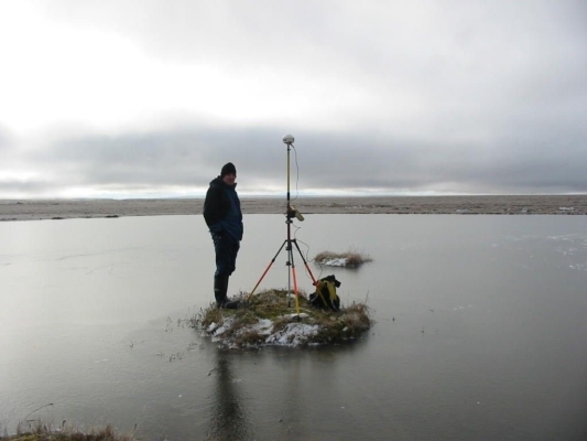Person standing with equipment